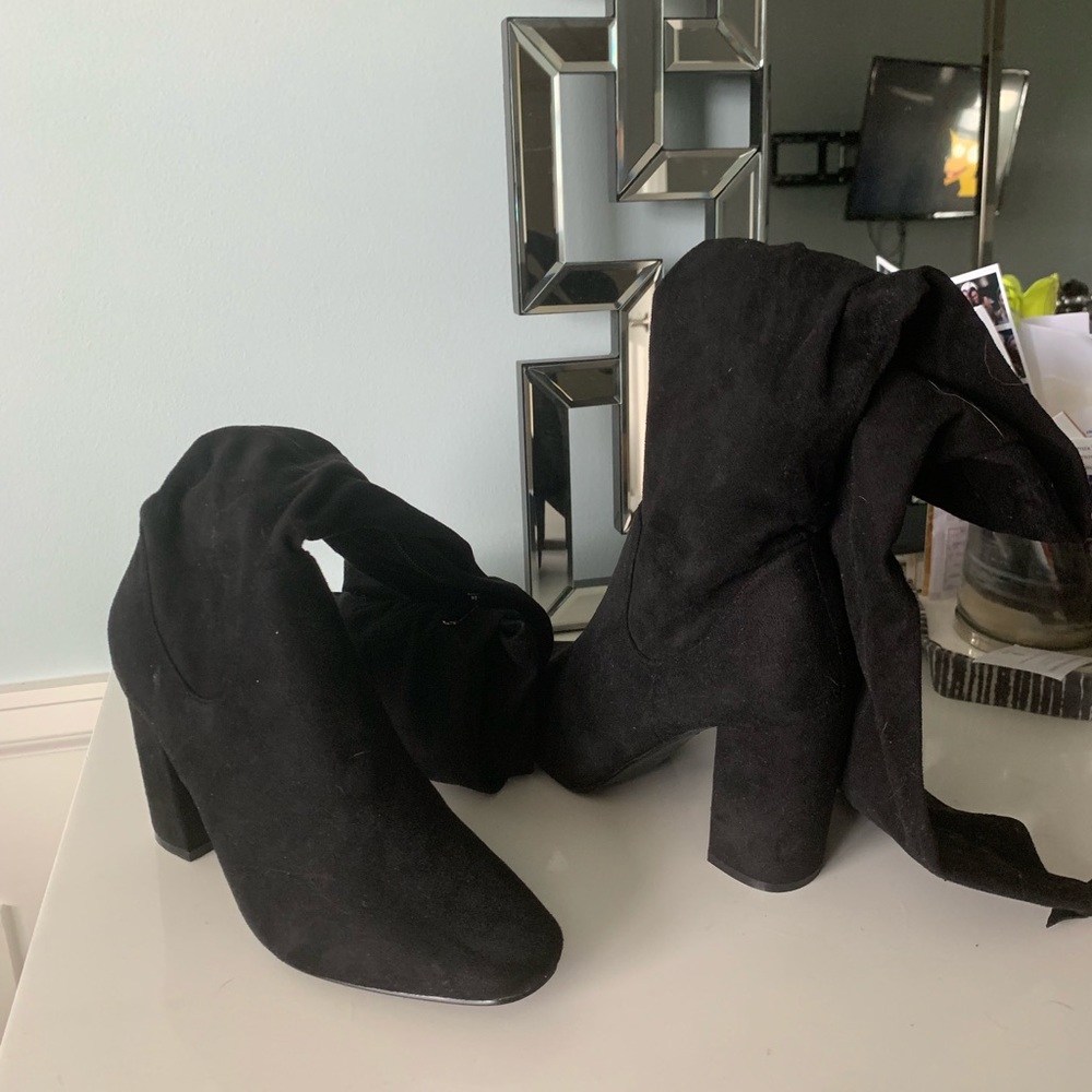 Thigh high black boot